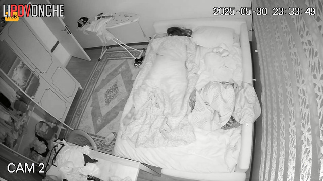 Lonely woman jumping under the blanket in the night