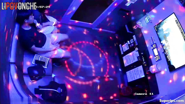 Asian teens fooling around in the karaoke club, look