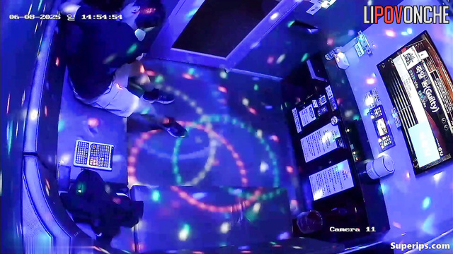 Asian teens fooling around in the karaoke club, look