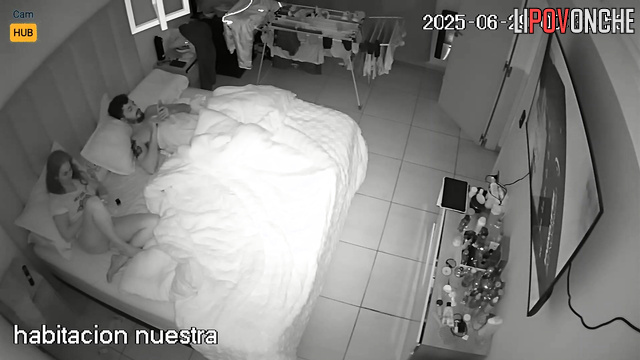 Couple not only watching TV but also doing other things