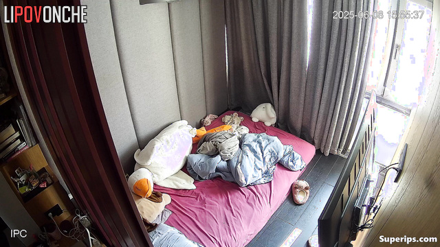 A young girl plays with her hairy pussy while watching porn on her phone