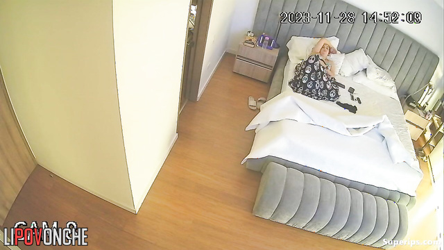 The husband lay down on the bed to rest, but his wife sat on his face