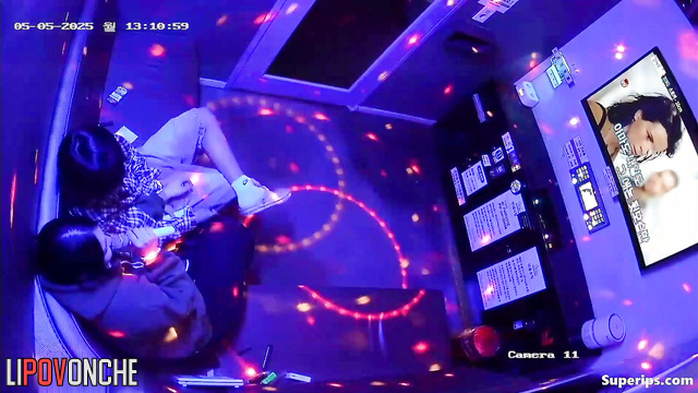 Young Asian girl gives her boyfriend a fantastic blowjob in a karaoke room