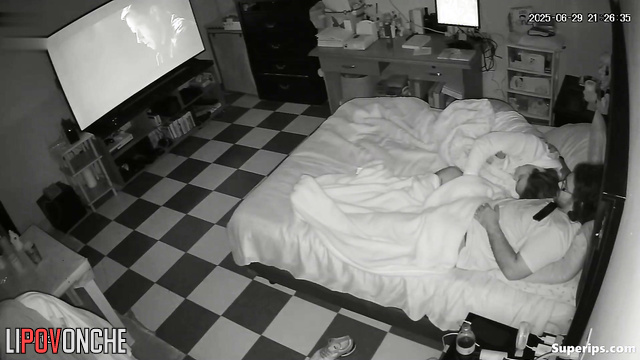 The wife distracted her husband from watching the movie by caressing his cock