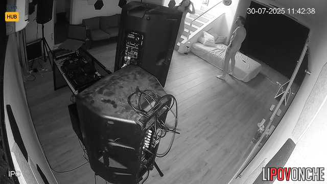 Lovers fucking in the living room, unaware their joy is being filmed