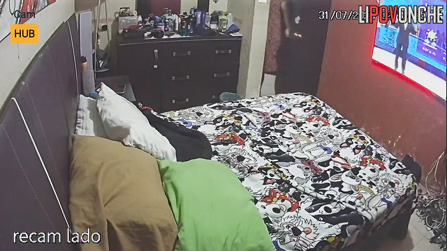 Spouses enjoying oral sex, blind to the secret surveillance