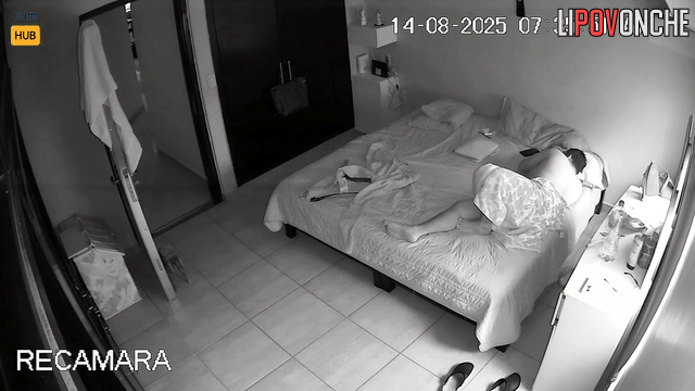 Mexican couple cuddles close, not knowing they are under watch