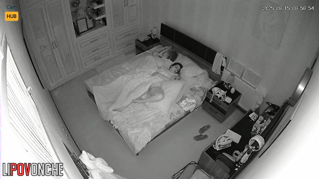 Couple sleeps soundly, not knowing they are being filmed