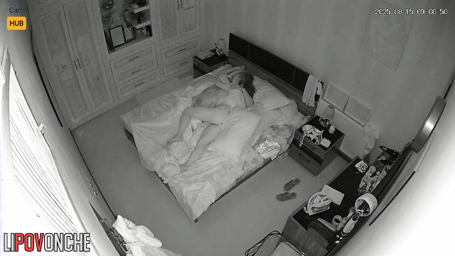 Couple sleeps soundly, not knowing they are being filmed