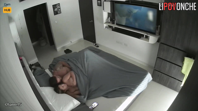 Naked people enjoying love unaware of the secret surveillance