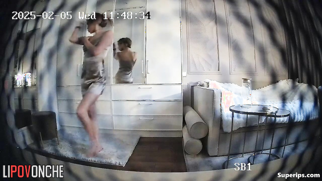 Young blonde dancing and dressing at the same time
