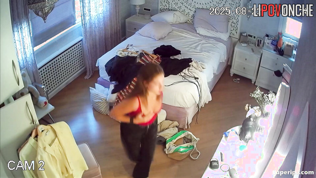 Sexy teenage girl watches her breasts bounce seductively as she dances