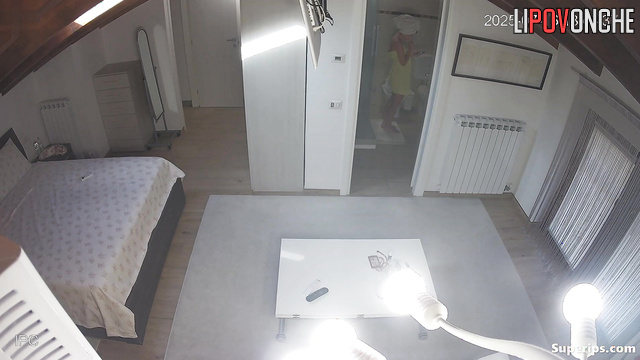 A young, skinny student walks around her bedroom completely naked