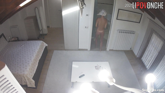 A young, skinny student walks around her bedroom completely naked