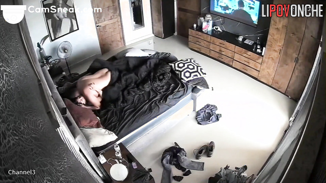 A husband distracts his young wife from watching a movie with a pleasant fuck