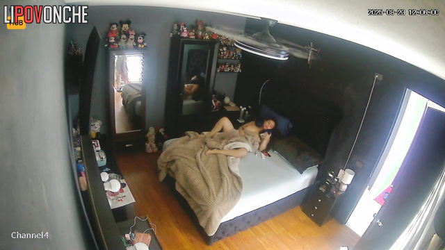 Naked lady was unaware that a camera recorded her in the bedroom