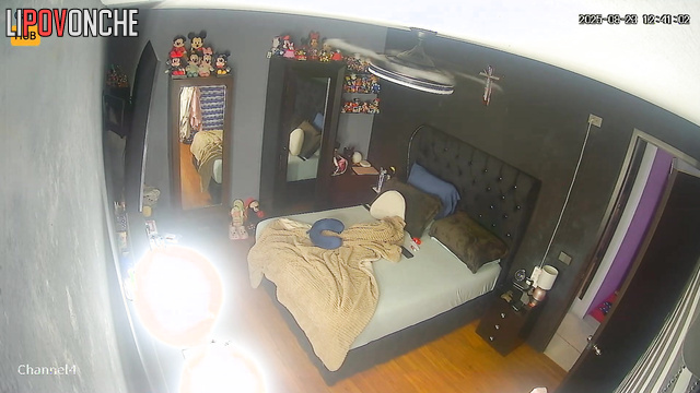 Naked lady was unaware that a camera recorded her in the bedroom
