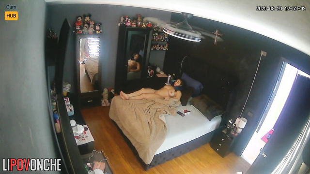 Naked lady was unaware that a camera recorded her in the bedroom