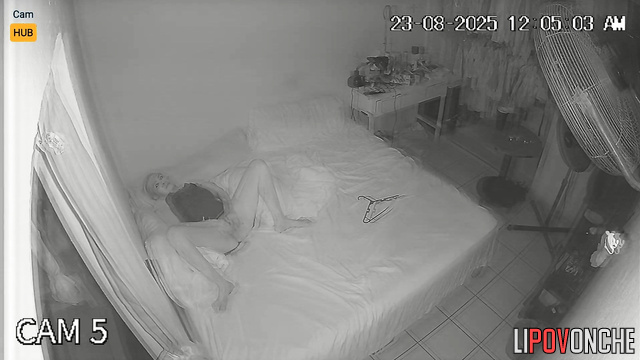 A bored blonde spreads her labia in front of a fan blowing on her cunt