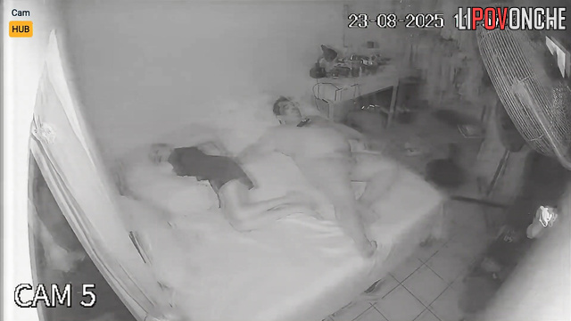 A bored blonde plays with her pussy while her fat husband watches TV