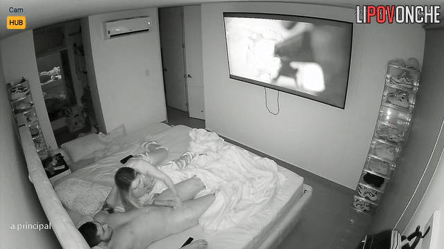 While her bored husband watches a movie,  Colombian wife licks his cock