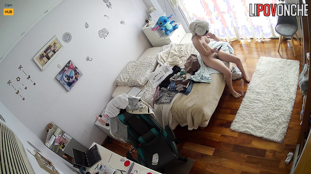 A skinny teenage girl with a hairy pussy relaxes completely naked after a shower