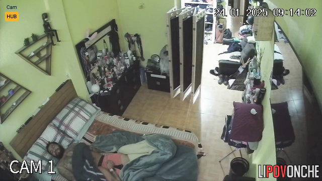Bearded tattooed man relaxes during blowjob performed by his wife