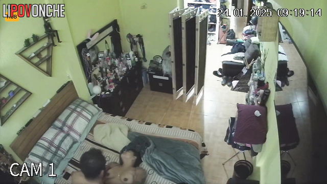 Bearded tattooed man relaxes during blowjob performed by his wife