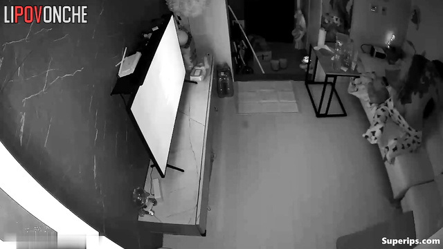Asian couple having sex in cowgirl position and watching tv