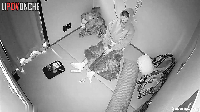 Two people seek privacy, not sensing unseen eyes on them