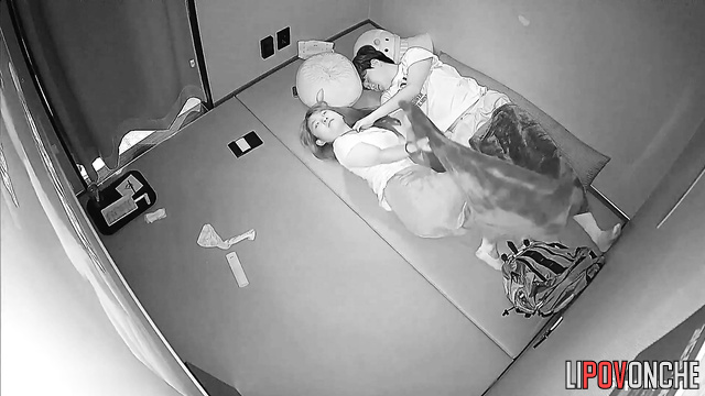 Two people seek privacy, not sensing unseen eyes on them
