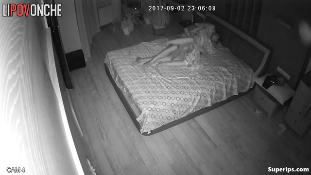 Couple fucking in the bedroom, unaware of watching eyes