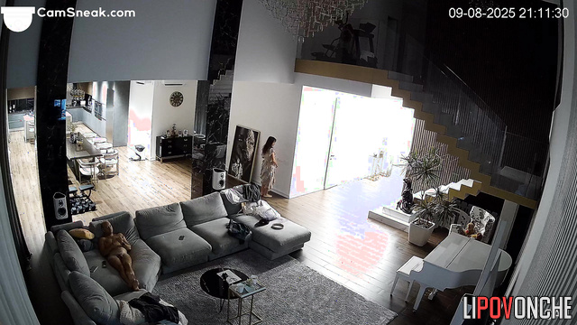 Lovers rested in the living room while a stranger watched them