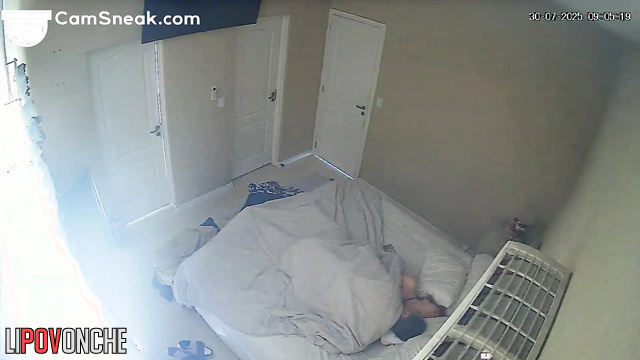 Someone concealed monitors the spouses as they fucked