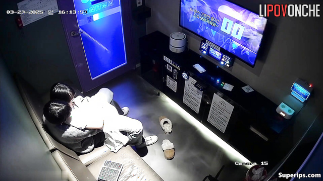 Cute asian couple fooling around in the karaoke club