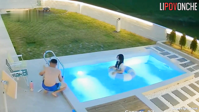Asian couple chilling together in pool (they had hard working day)