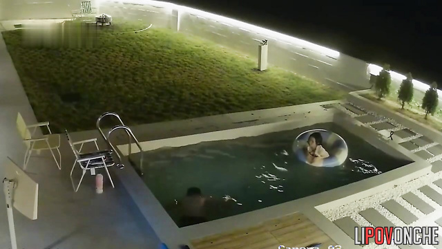Asian couple chilling together in pool (they had hard working day)