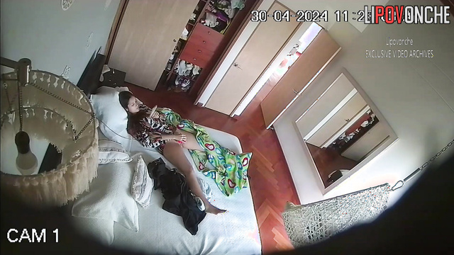 Pretty brunette playing with a sex toy alone (video from bedroom)
