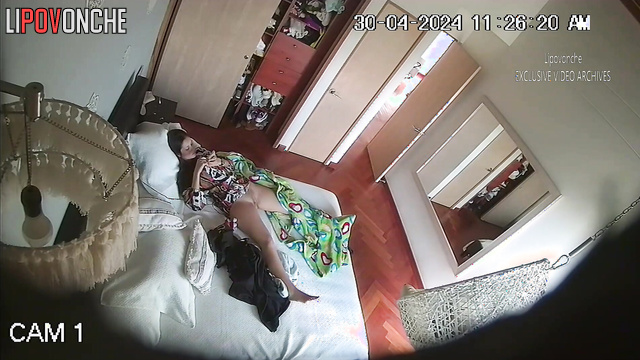 Pretty brunette playing with a sex toy alone (video from bedroom)