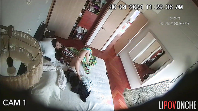 Pretty brunette playing with a sex toy alone (video from bedroom)