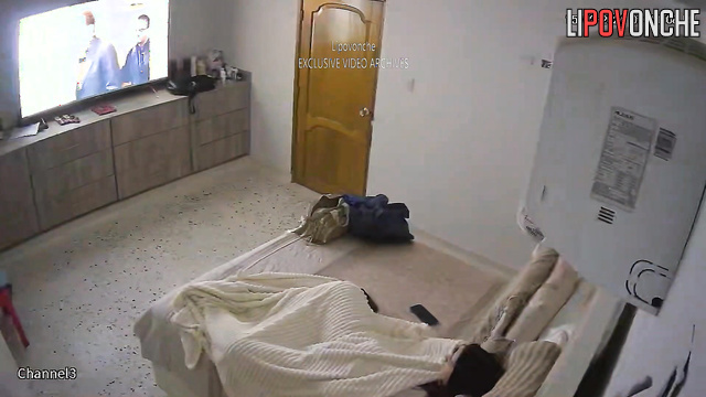 Brunette masturbating with a small sex toy under sheets