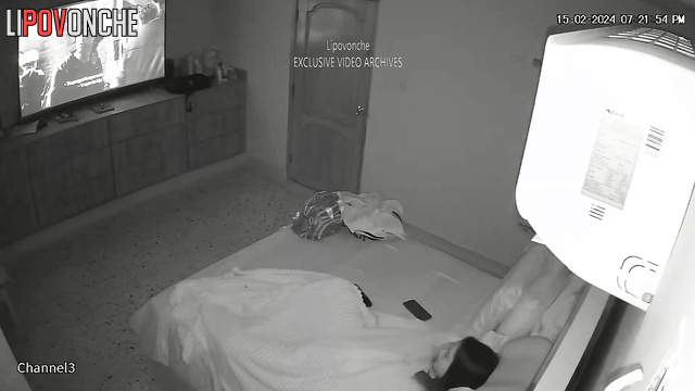 Brunette masturbating with a small sex toy under sheets