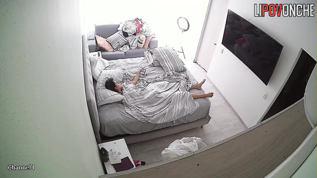 Brunette with smooth pussy masturbates on bed under blanket