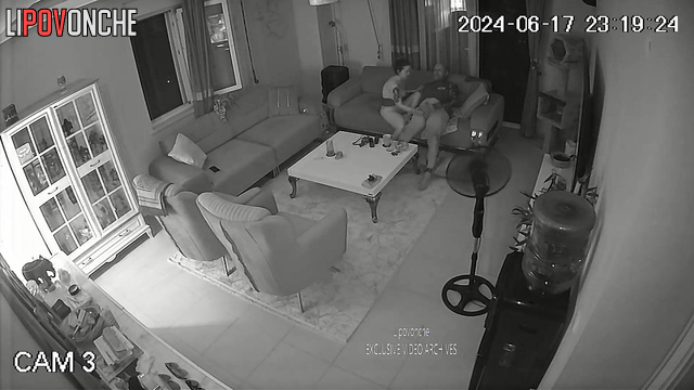 Tattooed couple jerk each other off in the living room