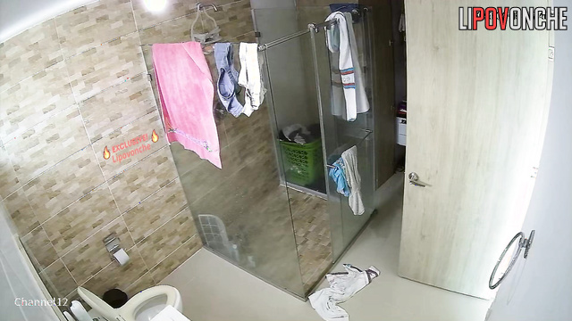 A young couple takes turns showering and changing clothes