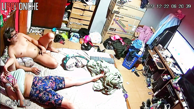 Couple fucking in a dirty room in front of the TV.