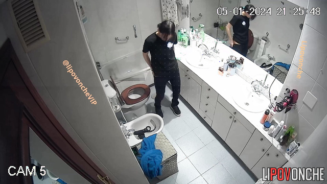Pretty brunette sitting on the toilet and peeing