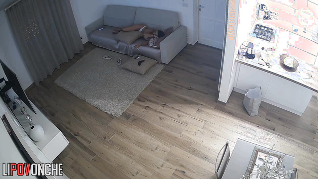 Busty brunette is bored with tv watching (living room tape)