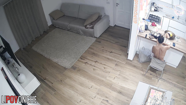 Busty brunette is bored with tv watching (living room tape)
