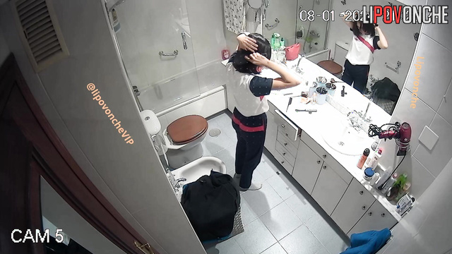 Pretty teen dressing up for the night party (bathroom video)